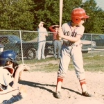 Brian playing baseball, 1970s